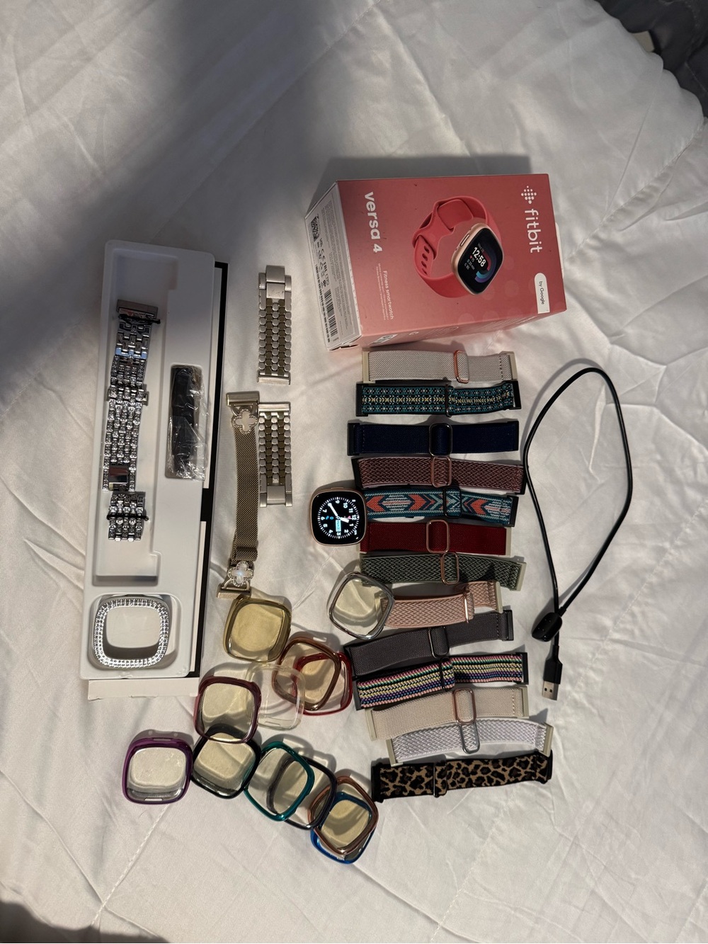 fitbit Versa 4 Rose GoldSmartwatch with Assorted Bands and Cases